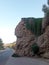 A talus  a mountain , palm trees and a road in Fiuig