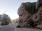 A talus  a mountain , palm trees and a road in Fiuig