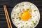 Tamago Kake Gohan Recipe Egg Over Rice close up in the bowl. Horizontal top view