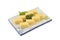 Tamago set in white square dish. Sweet Omelet or egg roll in Japaneses tradition style