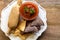 Tamale with hot tomato sauce and white and blue corn tortillas o