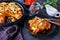 Tamale pie on a black baking dish, close-up