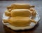 Tamales on white plate on Wooden table