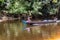 TAMAN NEGARA, MALAYSIA - MARCH 15, 2018: People boating on Tahan river in Taman Negara national park, Malaysi