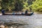 TAMAN NEGARA, MALAYSIA - MARCH 15, 2018: People boating on Tahan river in Taman Negara national park, Malaysi