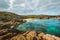 Tamarells beach in a sunny and cloudy day, abandoned paradise in Menorca, a Spanish Mediterranean island, after the covid 19