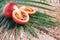 Tamarillo fruit or terong belanda with palm leaves on rattan background. Copy space. Tropical travel, exotic fruit. Vegan and