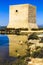 Tamarit tower surrounded by salt lagoons in Santa Pola