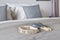 Tambourine and maracas setting on bed with gray color scheme bedding