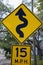 Tampa, Florida / USA - May 5 2018: 15 MPH low angle street sign with the symbol of a squiggly line