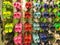 Tampa, USA - May 10, 2018: Rack with lots of pairs of childrens soft rubber sandals or Crocs in various pink, blue