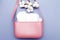 tampons, hygienic panty liners, feminine sanitary pads in a women's pink cosmetic bag