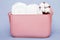 tampons, hygienic panty liners, feminine sanitary pads in a women's pink cosmetic bag