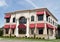 Tan Building with Red Awnings