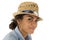 Tan teenage girl wearing a straw woven fedora hat