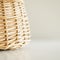 Tan Wicker Basket on a White Surface