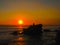 Tanah Lot and sea waves in golden sunset, Bali