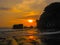 Tanah Lot and sea waves in golden sunset, Bali