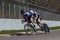 Tandem Cyclists Practicing on racetrack