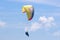Tandem Paraglider flying yellow wing