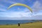 Tandem paraglider launching at Newgale