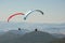 Tandem paragliders thermalling in Puy de Dome, Auvergne, French Massif Central. France