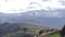 Tandem Paragliding Flying Over Rural Area In Andes