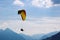 Tandem paragliding in Swiss Alps. Silhouettes of paragliders and beautiful mountains. Extreme sport, adventure sports. Adventurous