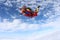 Tandem skydiving. Happy skydivers are in the amazing sky.