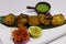 tandoori fish tikka, clay oven roasted ajwain flavored fish cubes, coated with gram flour, yoghurt and spices