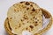 Tandoori naan bread or roti in a basket, indian clay oven baked bread