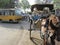 Tanga cart is standing. School bus standing in Ajmer city, India