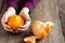 Tangerine in children hands