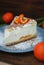 Tangerine citrus Cheescake Homemade on Gray Plate over Wooden Background. Top View. Dessert. Horizontal Image.