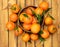 Tangerine fruits over old wooden background, top view, overhead