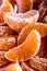 Tangerine or mandarin orange segments peeled close up background texture.