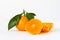 Tangerine Orange or clementine with green leaf with sliced orange