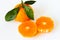 Tangerine Orange or clementine with green leaf with sliced orange