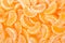 Tangerine segments, orange background