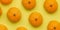 Tangerines background. Ripe fruits on a colored background. Citrus fruits. Cosmetics, medicine and healthy food.