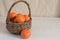 Tangerines in basket on left, room for text