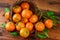 Tangerines basket scattered fruits