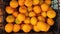 Tangerines in a box, harvest of tangerines, citrus fruits top view