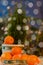 Tangerines in Christmas decor with pine tree. Solar fruit energy of the sun, symbol happiness, wealth and success