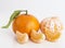 Tangerines or clementines fruits and peeled segments