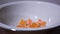 The tangerines disappear from the plate in stop motion