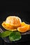 Tangerines with leaves on an old fashioned country table. Selective focus. Vertical.