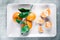 Tangerines, mandarines, clementines, citrus fruits with leaves on plate, flatlay - rustic, vintage and healthy eating concept
