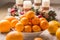 Tangerines and oranges on christmas table with advent wreath