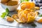 Tangerines with peel and mellisa herbs on table. Ripe fresh tropical fruit on wooden board